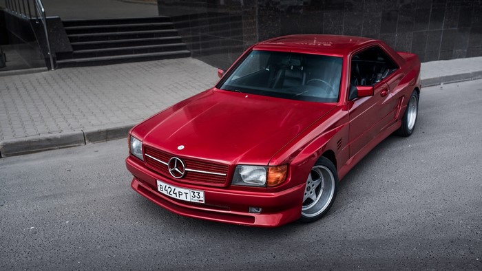 Red Mercedes-Benz C126 Coupe on a City Street