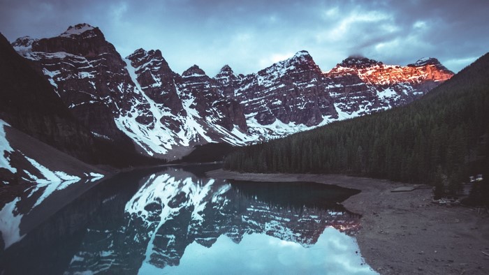 Snow-capped mountains reflected in a lake