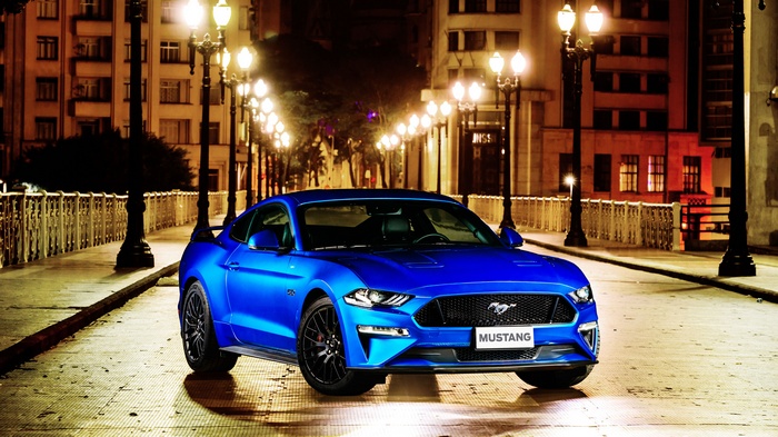 Blue Ford Mustang GT Fastback on a Street at Night