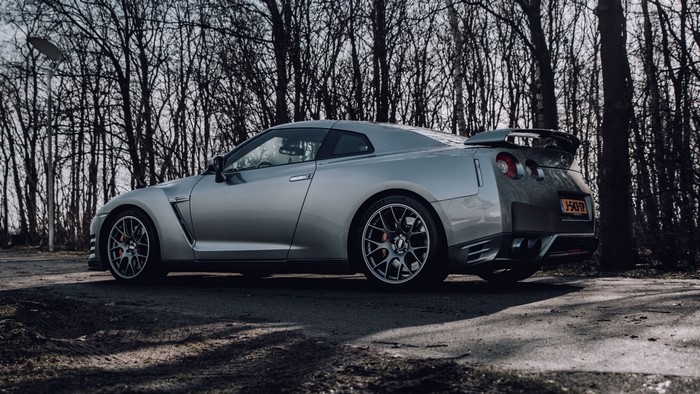 Silver Nissan GT-R parked near trees