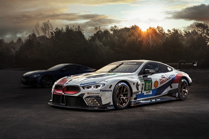 BMW M8 GTE race cars at sunset