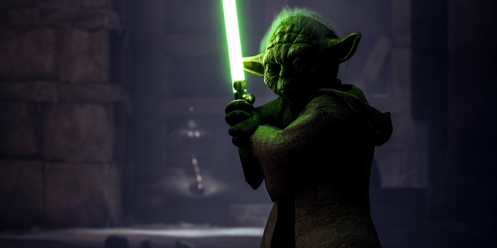 Yoda from Star Wars: Battlefront holding a lightsaber