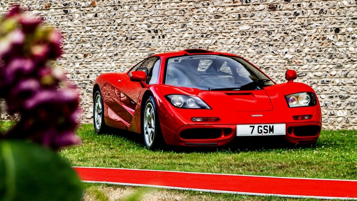 Red McLaren F1 car with license plate 7 GSM