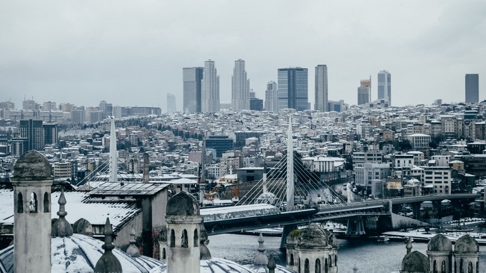 Istanbul cityscape with snow-covered buildings and modern skyscrapers