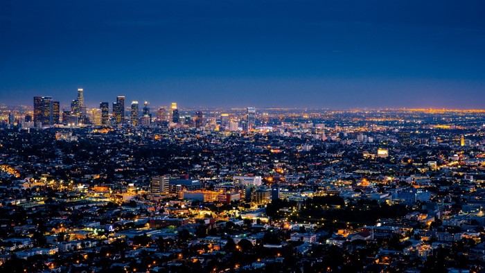 Night cityscape with illuminated buildings and skyline