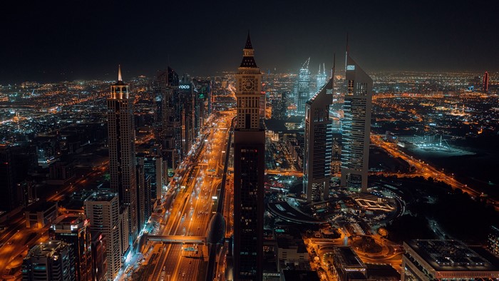 Night cityscape with skyscrapers and highway