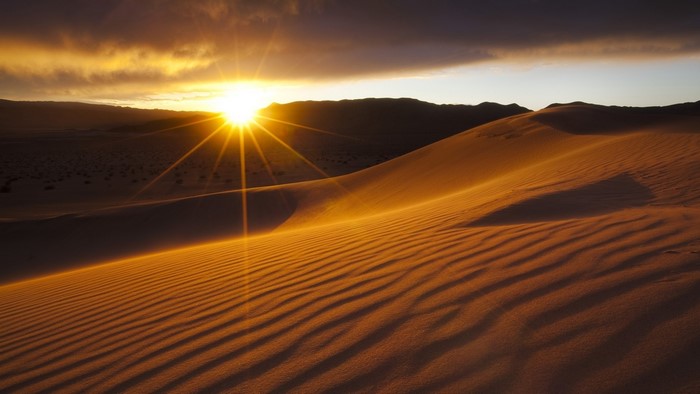 Sunset over sand dunes