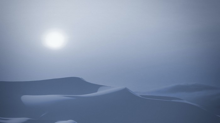 Desert dunes under a hazy sun
