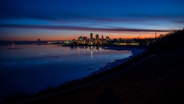 Cleveland skyline at dusk over Lake Erie