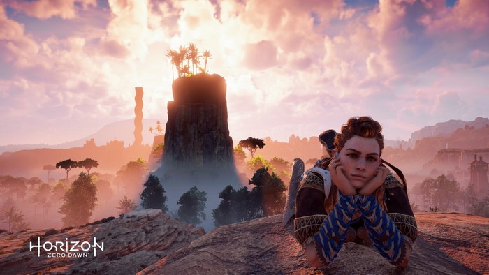 Aloy from Horizon Zero Dawn resting on a rock
