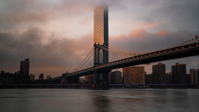 Manhattan Bridge and skyscrapers at sunset