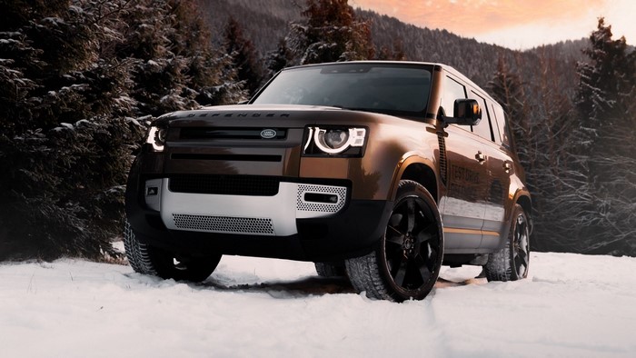 Land Rover Defender in a Snowy Forest