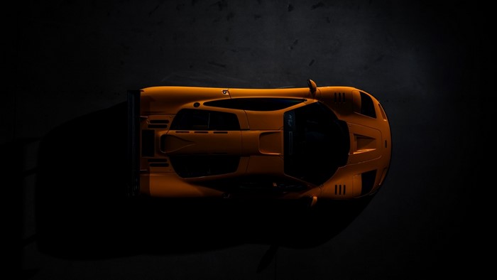 Orange McLaren race car from above