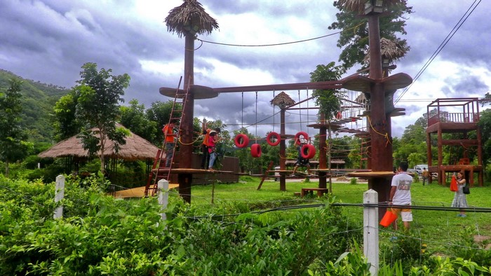 Adventure park with rope courses and people