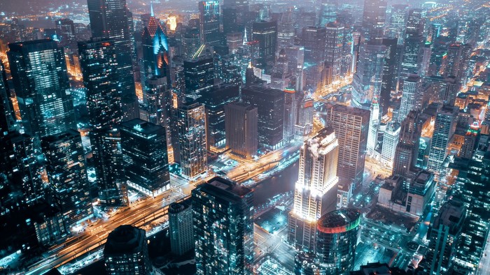 Night city skyline with illuminated skyscrapers