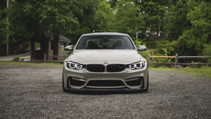 BMW M4 F82 parked on gravel