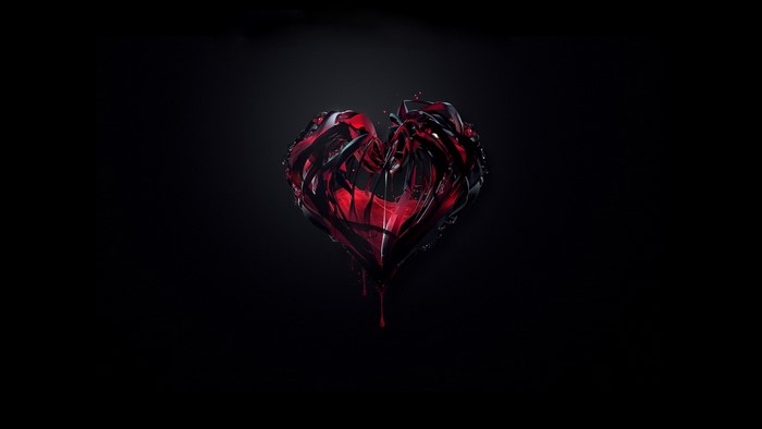 A broken red heart on a black background
