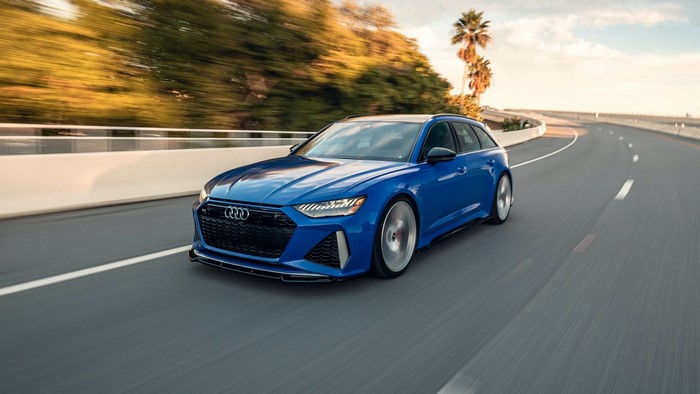 Blue Audi RS6 Avant driving on a highway
