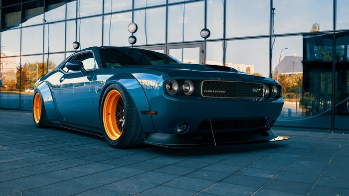 Blue Dodge Challenger SRT with orange rims