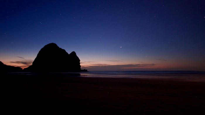 Beach at dusk with stars