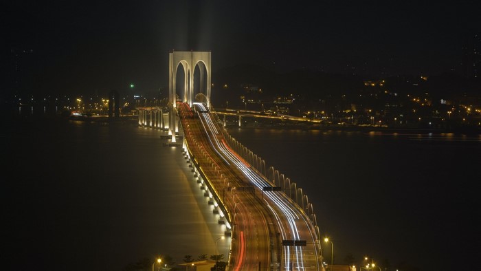 Bridge with light trails at night