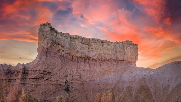 Rock formation against a dramatic sunset sky