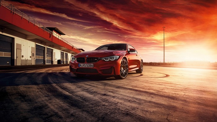 Red BMW M4 Coupe on Race Track