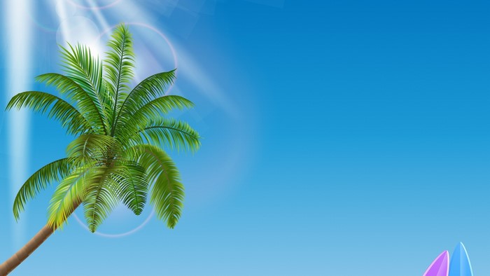 Palm tree and surfboards on a clear blue sky