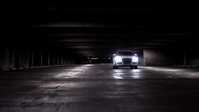 White Audi Q5 in a dark parking garage