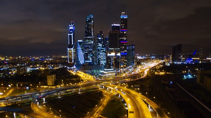Moscow City skyscrapers at night with highway