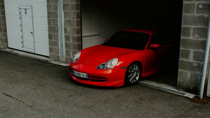Red Porsche 911 in a garage