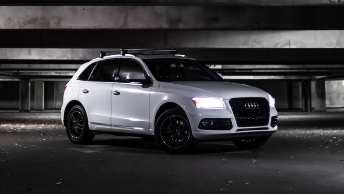 White Audi Q5 with roof rack