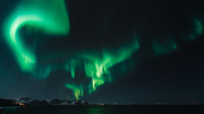 Northern Lights over Snowy Mountains