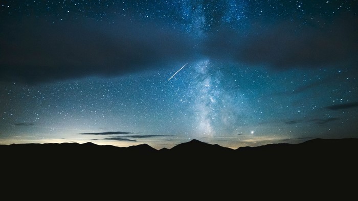 Milky Way and Meteor Shower Over Mountains
