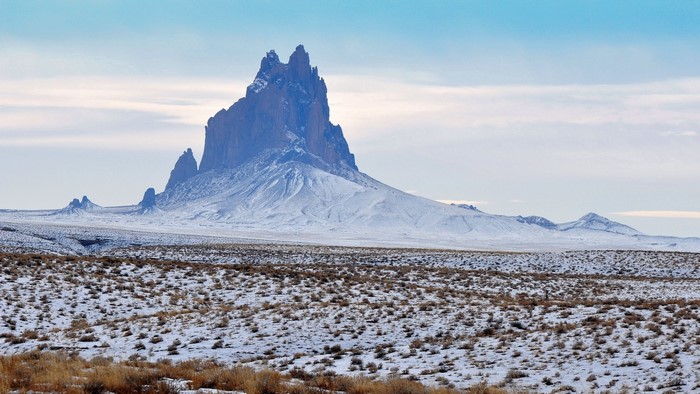 Shiprock Mountain in a Snowy Landscape