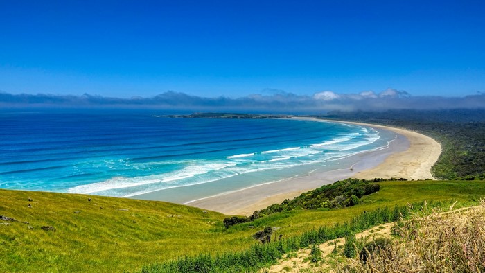4K Coastline with Rolling Green Hills and Ocean Waves