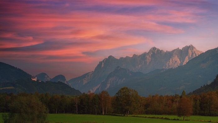 Mountain range with castle at sunset