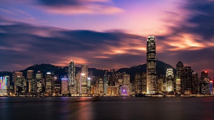 Hong Kong skyline at dusk with illuminated skyscrapers