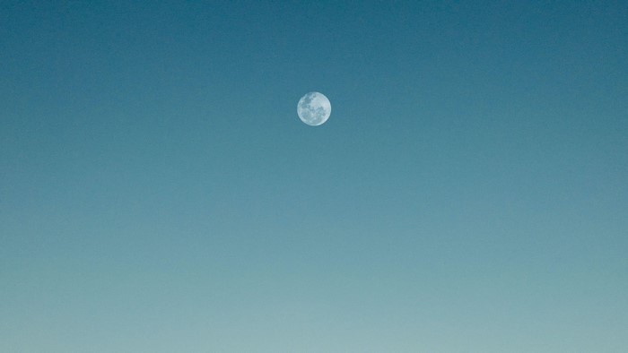The Moon in a Clear Blue Sky
