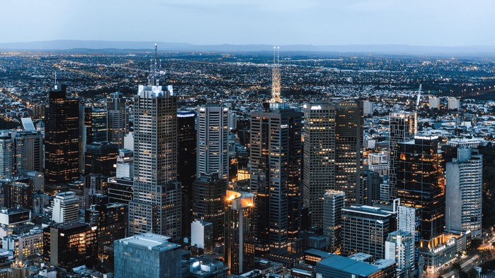 Cityscape with illuminated skyscrapers at dusk