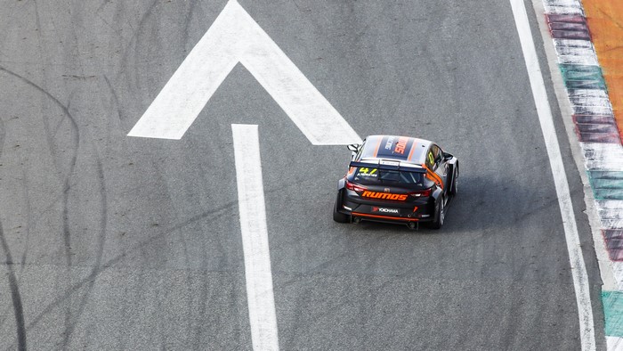 Race car on a track with arrow marking