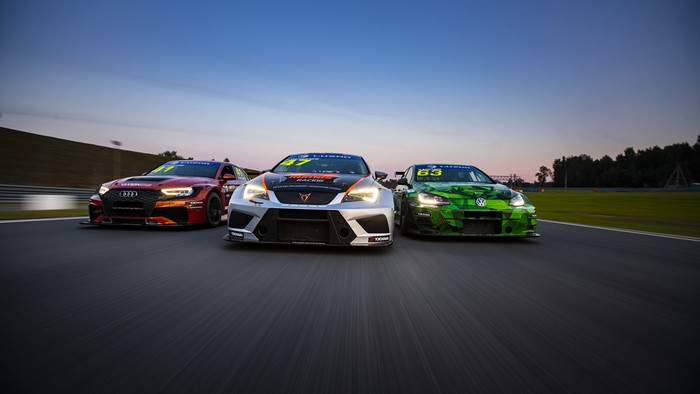 Three race cars on a track