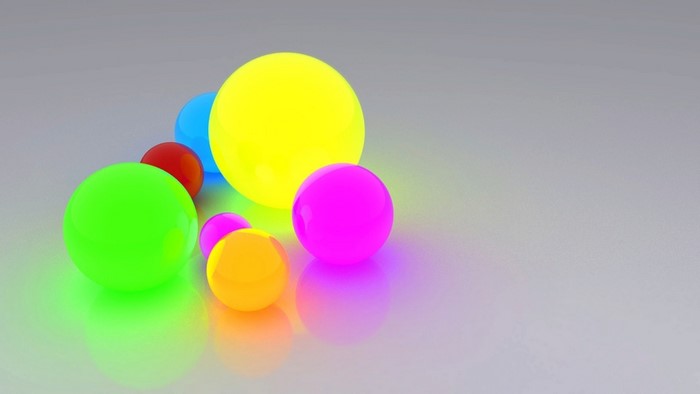 Colorful glowing spheres on a reflective surface