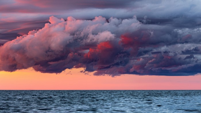 Dramatic clouds over the ocean at sunset