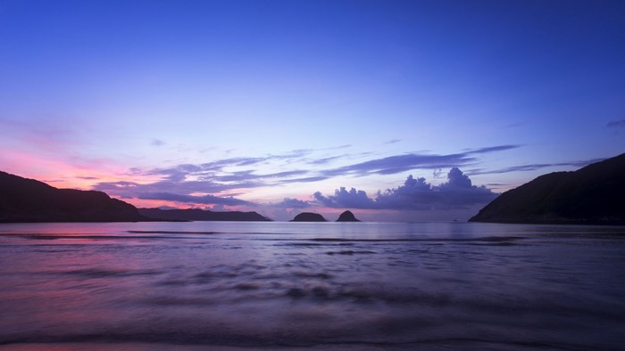 Ocean and mountains at dusk