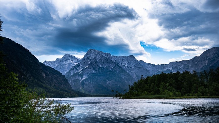 Mountains over a lake under a cloudy sky