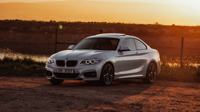 White BMW 2 Series Coupe at Sunset