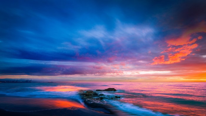 4K Sunset Over Ocean With Rocks