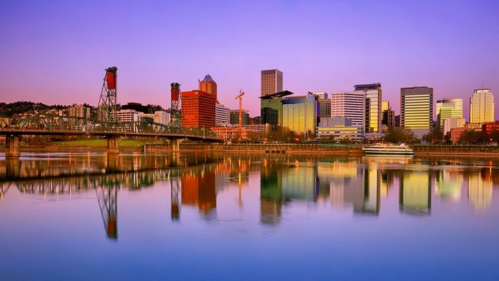 Portland skyline with bridge and river at sunset