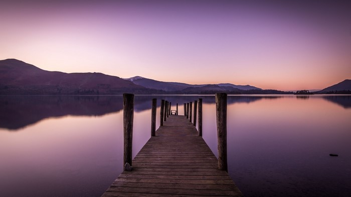 Wooden pier on a lake at sunset